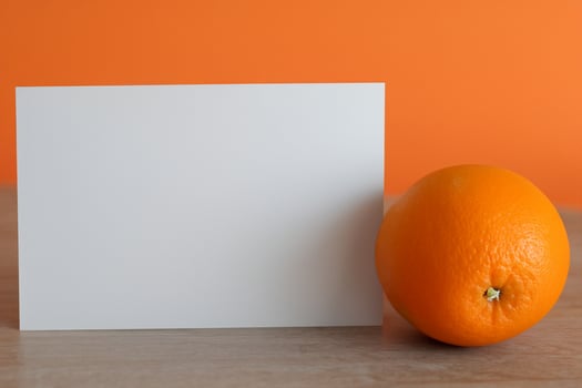 White Paper Mockup Enlivened by the Zesty Aura of Fresh Oranges, Crafting a Visual Symphony of Culinary Opulence and Wholesome Design photo