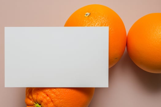 White Paper Mockup Enlivened by the Zesty Aura of Fresh Oranges, Crafting a Visual Symphony of Culinary Opulence and Wholesome Design photo