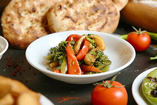 Close-up of a Colorful Bowl of Food on a Wooden Table photo