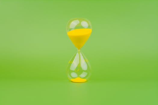 Hourglass, colorful countdown, time limit, time concept and importance of spending time. photo
