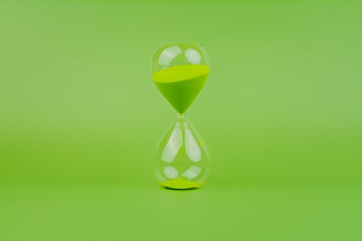 Hourglass, colorful countdown, time limit, time concept and importance of spending time. photo