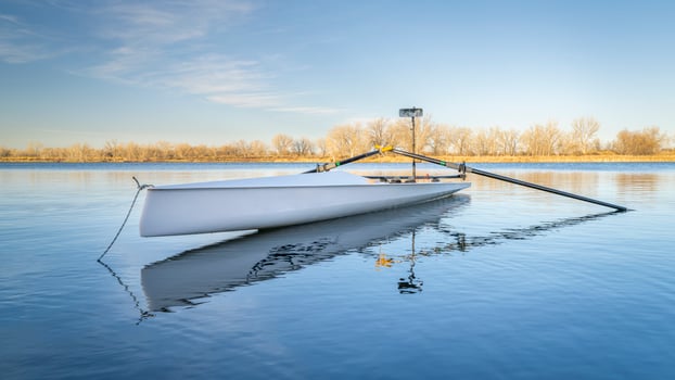 Coastal rowing shell by on a lake in northern Colorado in winter or early spring scenery. photo