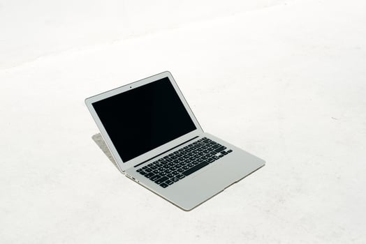 Modern metal laptop on a white background photo