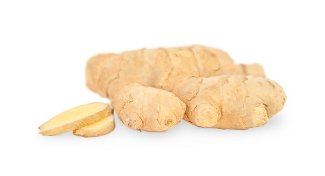 Whole ginger and it's slices isolated on white background photo