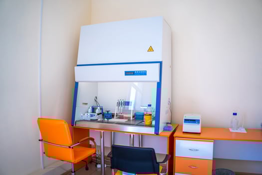 Serious clinician studying chemical element in laboratory. Laboratory of hematology. Pneumonia diagnosing. photo