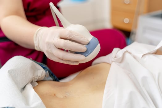 Qualified professional doctor using ultrasound equipment in clinic. Selective focus. photo