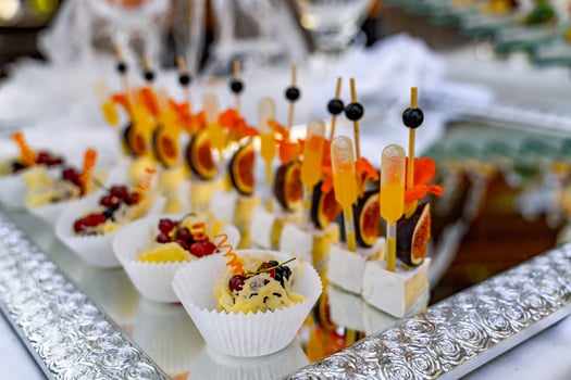 Lot of cold snacks on buffet table. Sweet appetizers. Catering at celebration. photo