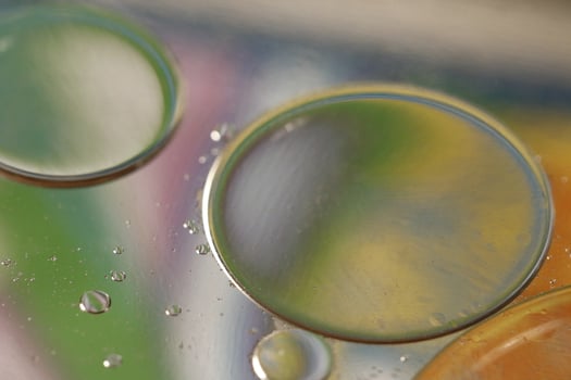creative photography, oil drops on water with colors photo