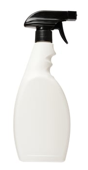 White plastic bottle with spray on an isolated background, container for household chemicals photo
