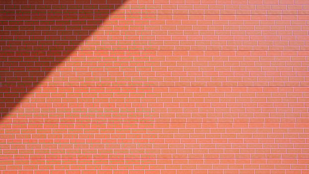 Sunlight and shadow on orange brick pattern surface of prefabricated smart board wall background photo