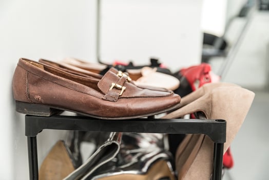 Old shoes on sale. Leather men's shoes with signs of wear. photo