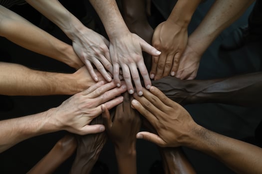 Hands of various races and ethnicities come together against discrimination. photo
