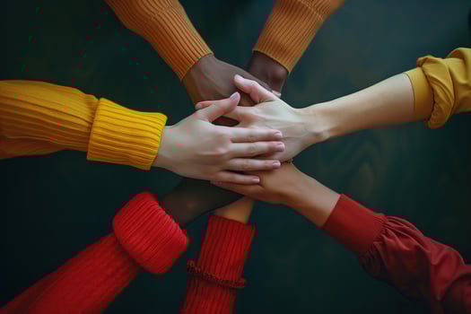 Hands of various races and ethnicities come together against discrimination. . photo