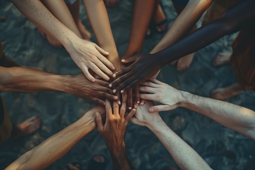 Hands of various races and ethnicities come together against discrimination. . photo