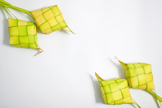 Close up Ketupat and copy space with isolated white background. Traditional culture in indonesia welcoming ramadhan season photo