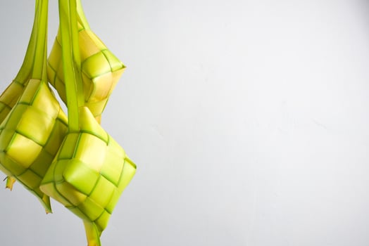 Close up Ketupat and copy space with isolated white background. Traditional culture in indonesia welcoming ramadhan season photo