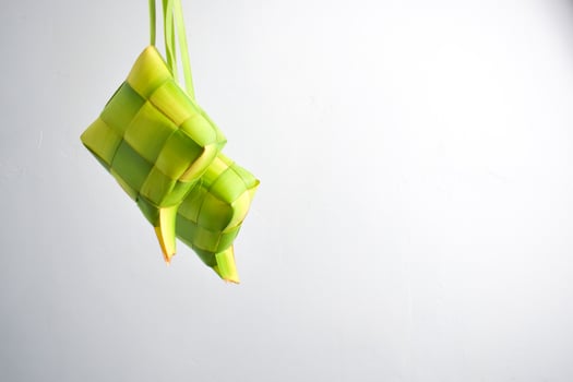 Close up Ketupat and copy space with isolated white background. Traditional culture in indonesia welcoming ramadhan season photo