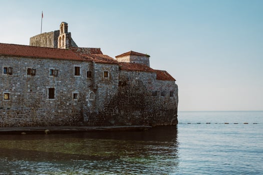 Amazing view of Budva old town and the sea. Beautiful cloudy sky. photo