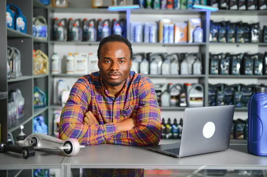 Smiling african Salesman Auto Parts Store photo