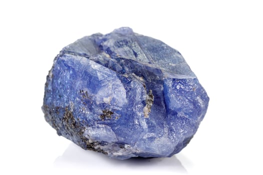 Macro blue tourmaline mineral stone on white background photo