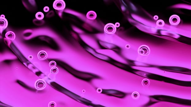 Neon bubbles move on surface of liquid. Design. Bright neon bubbles move on ripples of liquid. Beautiful bubbles move on abstract blurred liquid photo