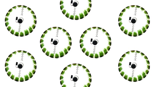 Abstract spinning wheels with green vegetation. Media. Concept of modern green farm. photo