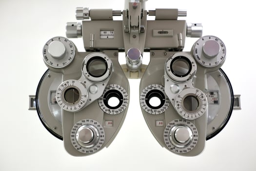 Phoropter for eye test, lenses glasses for eye check in optical store photo