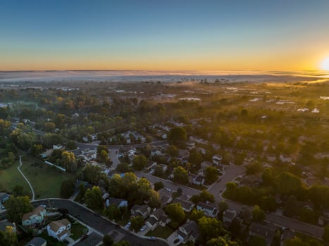 fall sunrise over residential area of Fort Collins in Colorado photo