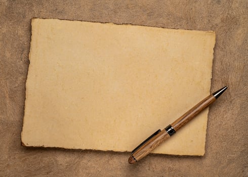 sheets of blank handmade paper with rough edges photo