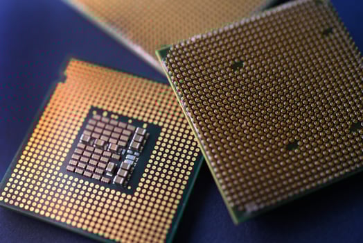 A computer processor on a blue background. Contacts on the processor case. photo