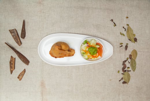 Samosa with chutey, sauce and salad served in a dish isolated on table top view of indian spices food photo