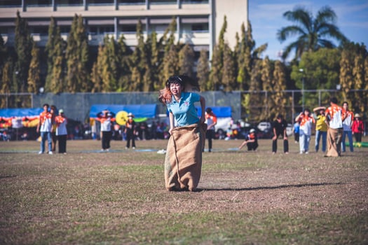ChiangMai Thailand  November 30 2022  Asian teenage students are doing a sack race for unity in Chiang Mai Rajabhat University photo