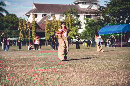 ChiangMai Thailand  November 30 2022  Asian teenage students are doing a sack race for unity in Chiang Mai Rajabhat University photo