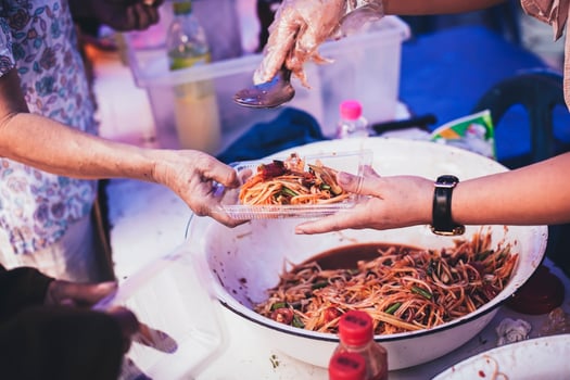 Hands of hungry people asking for free food from volunteers humanitarian aid concept photo