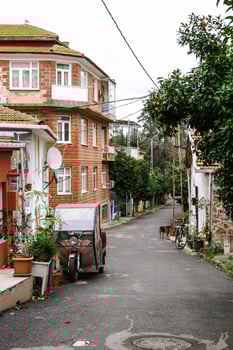 Istanbul, Turkey - January 12, 2023. Small Mediterranean Village Street With Traditional Brick Buildings. photo