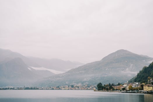 Misty mountains on the coast of Lake Como with luxury villas. Italy photo