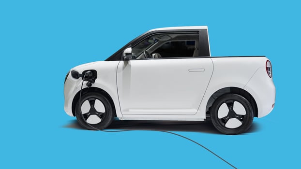 Modern electric mini truck on blue background photo