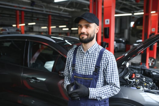 Male mechanic in car service center photo