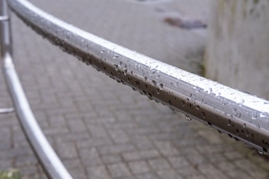 stainless steel railing in the rain photo