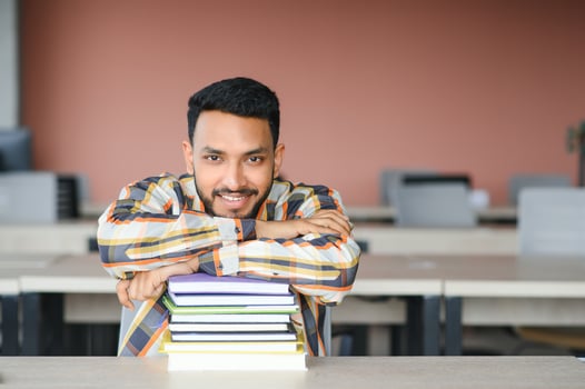 Happy indian male student at the university photo