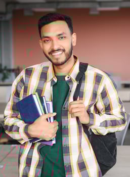 Happy indian male student at the university photo