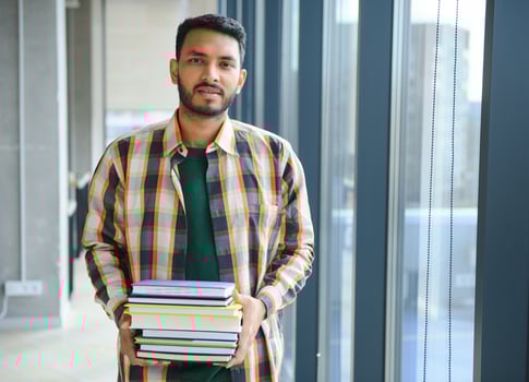 Handsome and young indian Male college student. photo