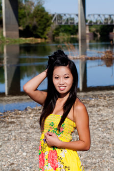 Asian American Woman Yellow Dress River Smiling photo