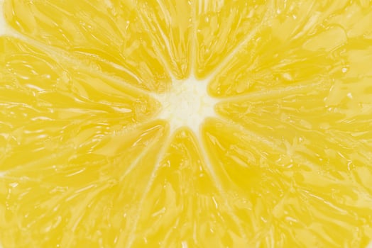 Macrophotography of sliced lemon structure - lemon background photo