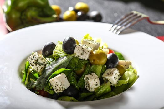GREEK SALAD with olive and leaves served in dish side view of arab food photo