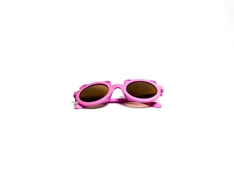 Isolated image of a pink child's glasses. Taking pictures from the side photo