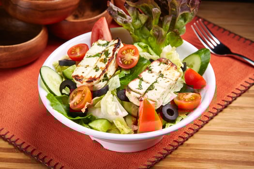 Halloumi Salad with tomato, cucumber, olive and salad leaves served in dish isolated on table side view of middle east food photo