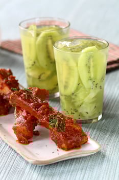 kiwi caipirinha with pork chops and sauce photo