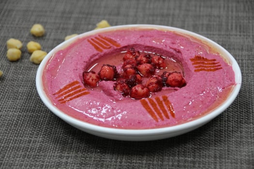 Beetroot Hummus served in a dish isolated on wooden table background side view of appetizer photo