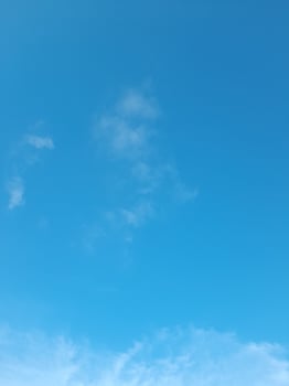 Beautiful white clouds on deep blue sky background. Large bright soft fluffy clouds are cover the entire blue sky. photo